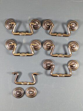 Set of 6 brass toned metal drawer pulls, drop pulls